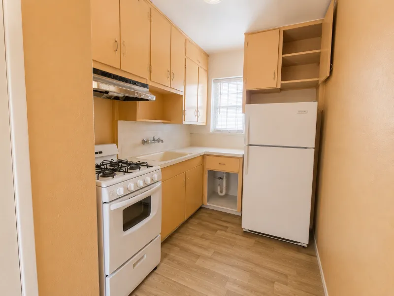 Kitchen with white appliances and wood cabinets